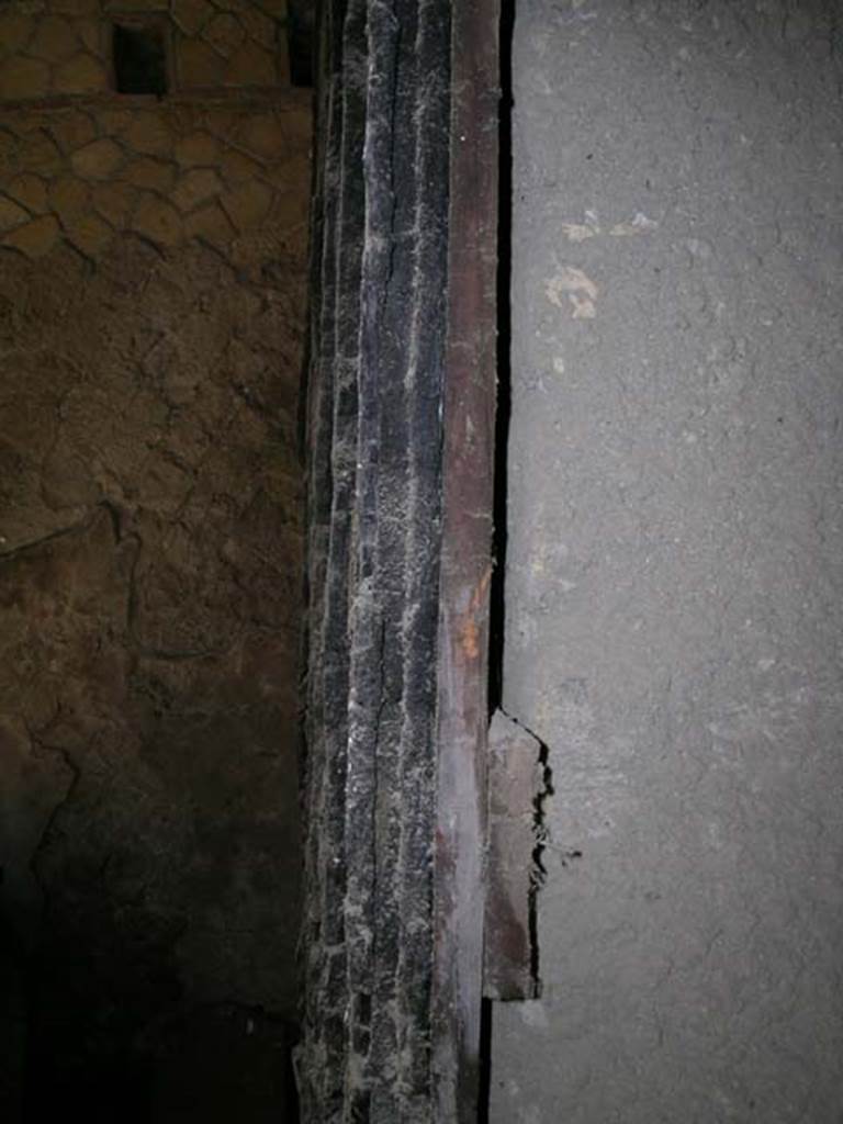 Decumanus Maximus, Herculaneum. May 2006. Carbonised wood on east side of doorway.
Photo courtesy of Nicolas Monteix.